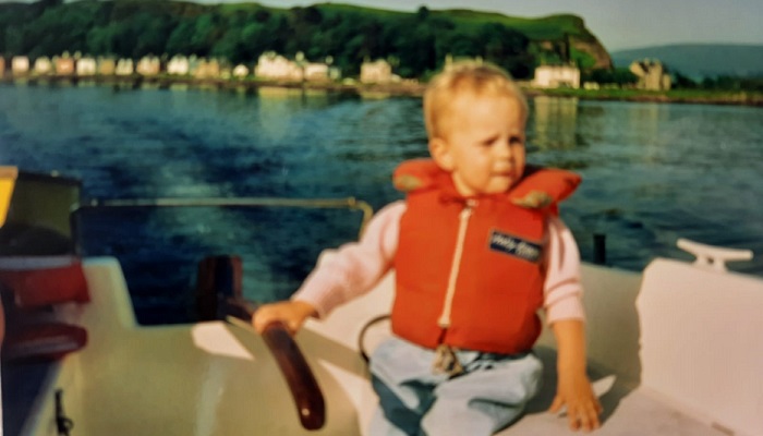 Eilidh Cox as a child on a boat