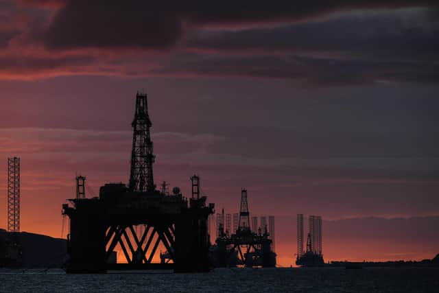 Oil rigs and drilling platforms are seen at sunrise. Picture: Peter Summers/Getty Images